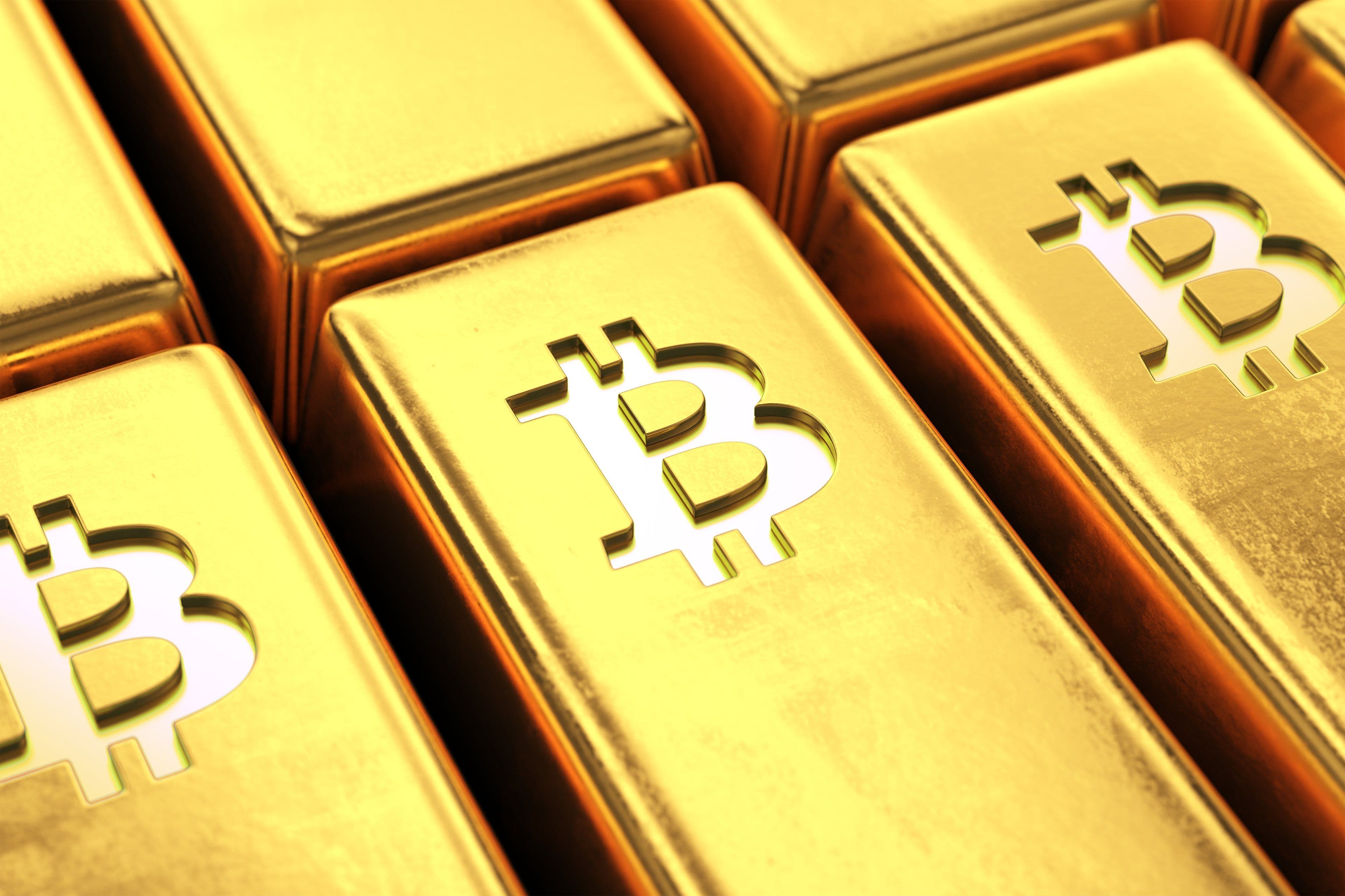 Các thỏi vàng có biểu tượng Bitcoin, thể hiện giá trị thực và vai trò tài sản trú ẩn của Bitcoin.