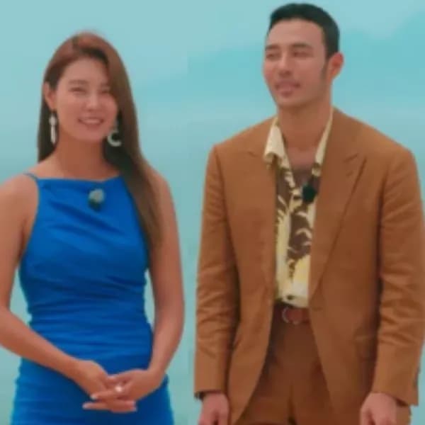 Cặp đôi thí sinh Single's Inferno 5 trong trang phục sang trọng, tượng trưng cho buổi hẹn hò riêng tư tại "Thiên Đường".