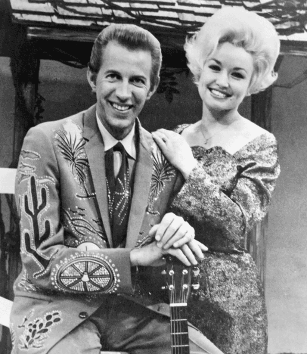 Dolly Parton và Porter Wagoner trong những năm đầu sự nghiệp, đánh dấu hành trình từ đôi dép rách đến đỉnh cao vinh quang.