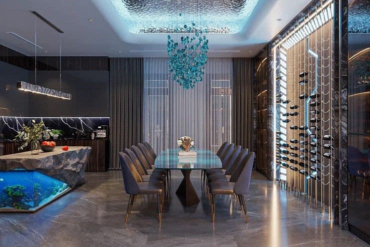 Không gian phòng ăn và bếp hiện đại, sang trọng với bàn ăn mặt đá xanh và đèn trần độc đáo.