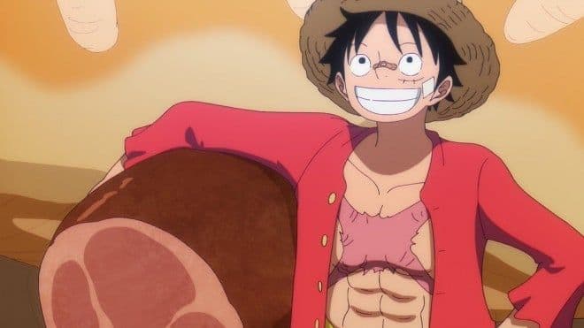 Monkey D. Luffy với miếng thịt lớn, biểu tượng cho tinh thần phiêu lưu và hành trình không ngừng nghỉ của One Piece.