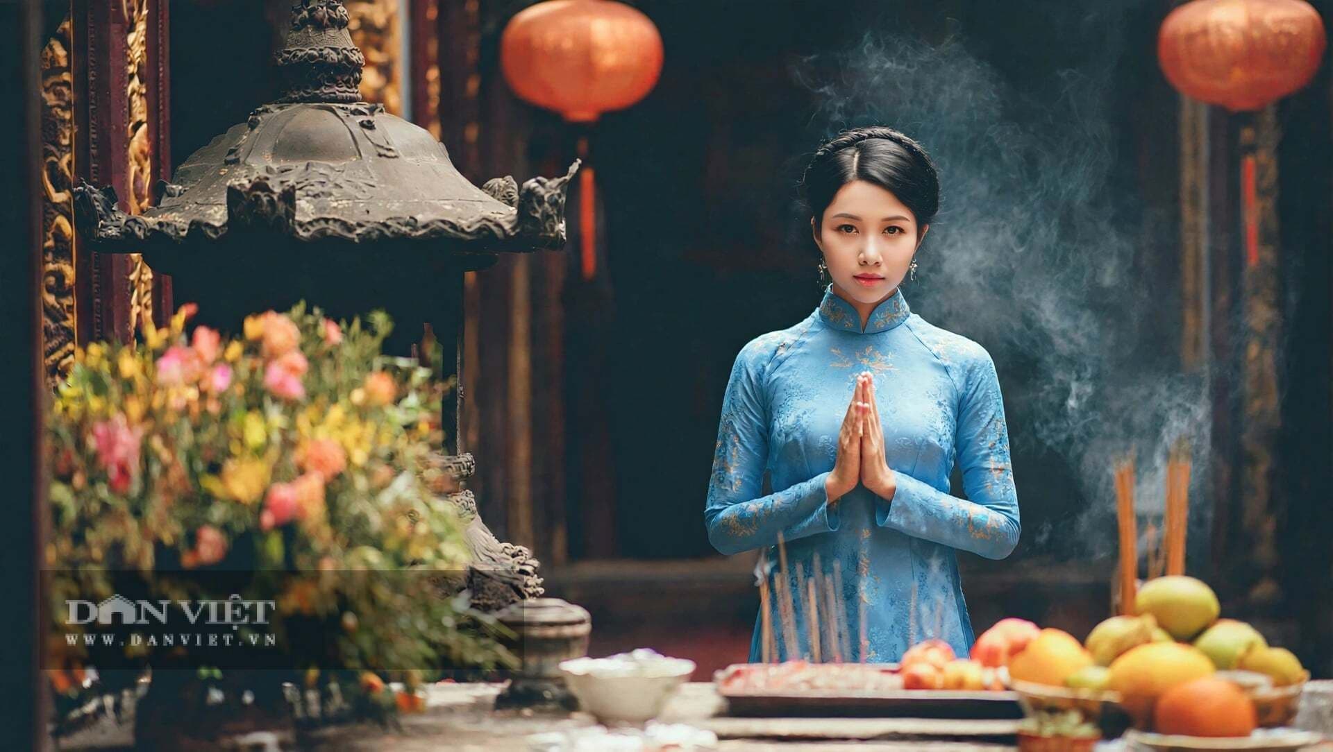 Người phụ nữ mặc áo dài xanh chắp tay thành kính cầu nguyện trước lư hương, thể hiện niềm tin và sự kết nối tâm linh.
