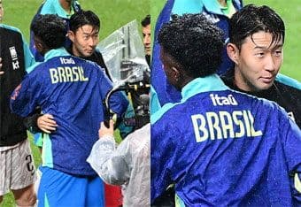 Son Heung-min (Hàn Quốc) và cầu thủ Brazil trao đổi sau trận đấu, thể hiện tinh thần thể thao.