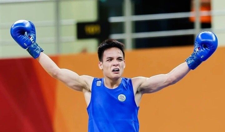 Võ sĩ Đinh Văn Tâm của Việt Nam ăn mừng sau khi giành huy chương tại ASIAD 20, niềm tự hào của thể thao nước nhà.
