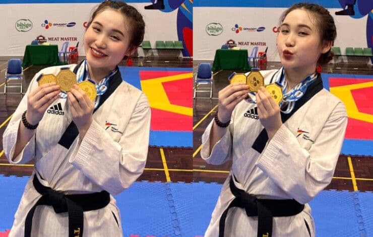 Vận động viên taekwondo Châu Ngọc Tuyết Sang tươi cười rạng rỡ với nhiều huy chương vàng, thể hiện niềm tự hào và thành công của thể thao Việt Nam.